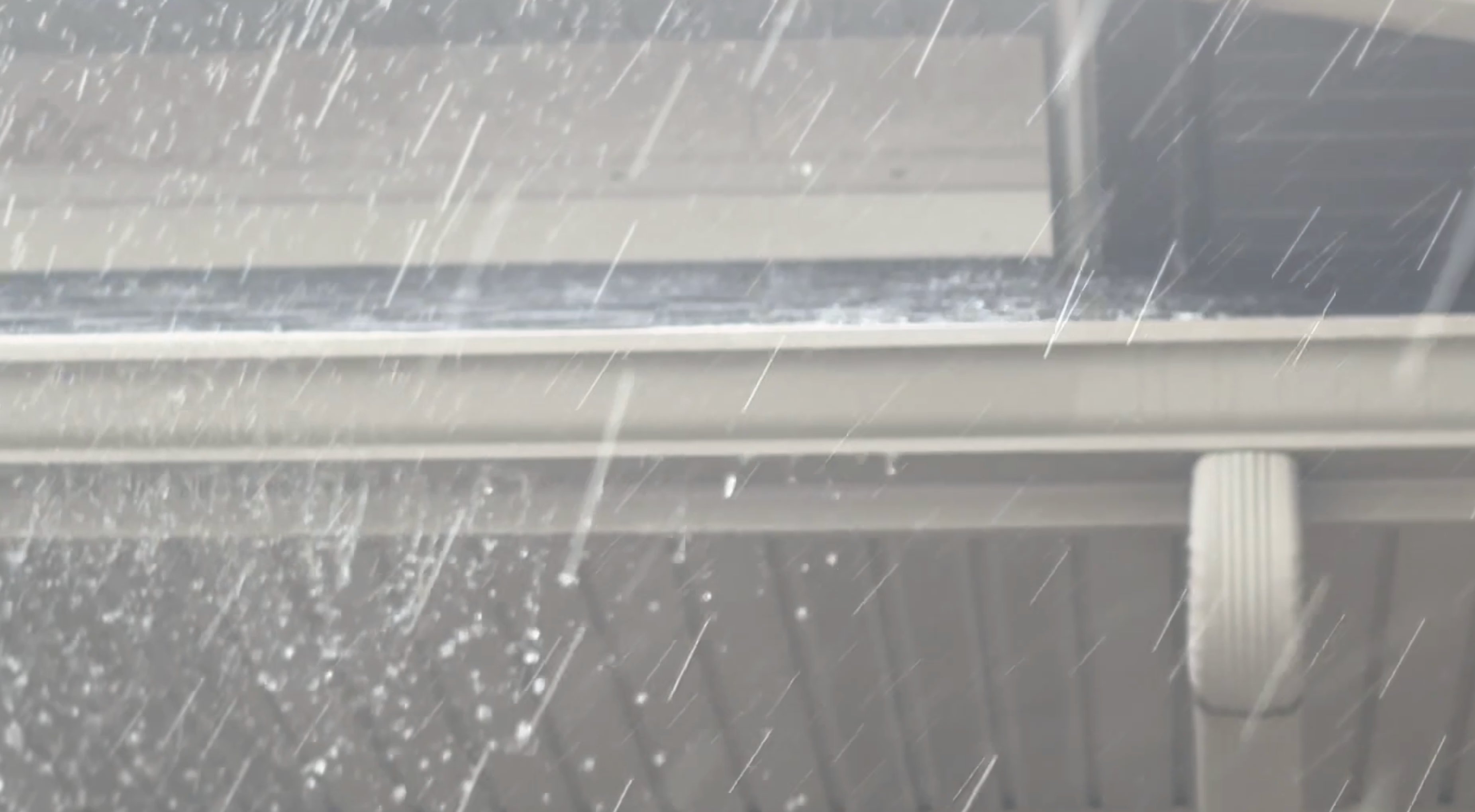 storm overflowing gutters
